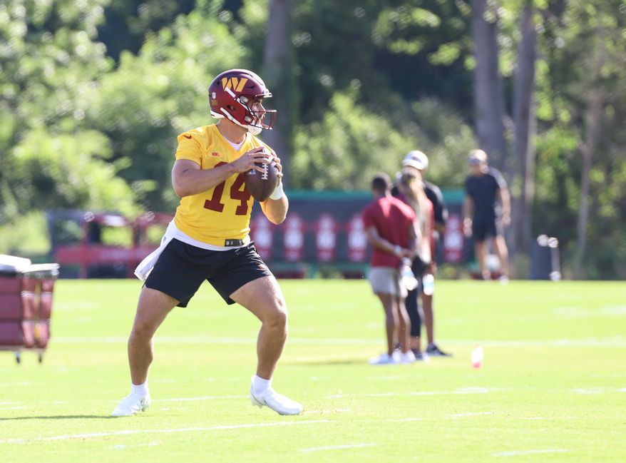 Washington Commanders Quarterback Sam Howell (14) about to make a throw at Day 5 of Training Camp at The Park in Ashburn VA on August 1st 2022. (Photo: Alyssa Howell)