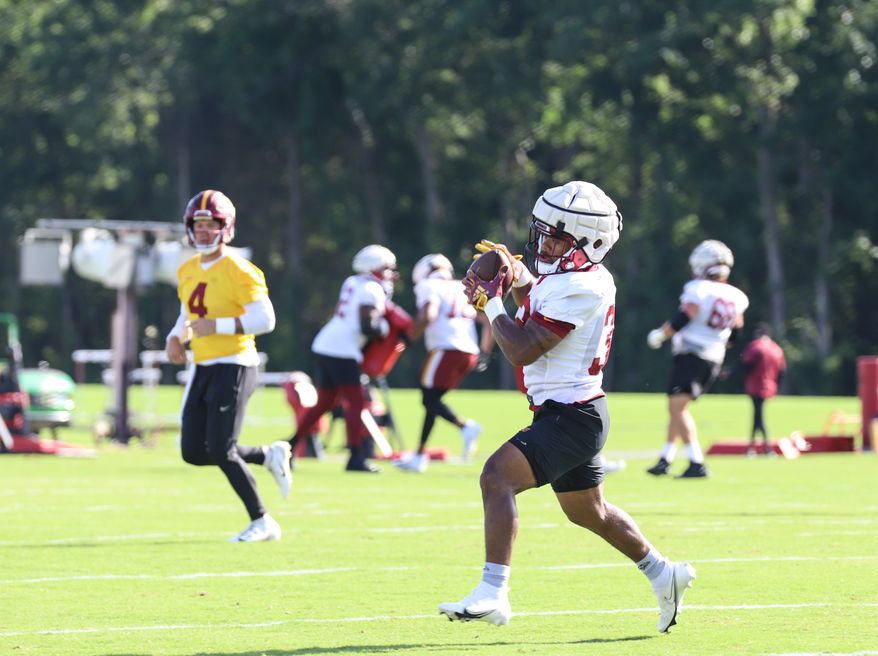 Washington Commanders Running Back Jaret Patterson (32) makes a catch, running with the ball at Day 5 of Training Camp at The Park in Ashburn VA on August 1st 2022. (Photo: Alyssa Howell)