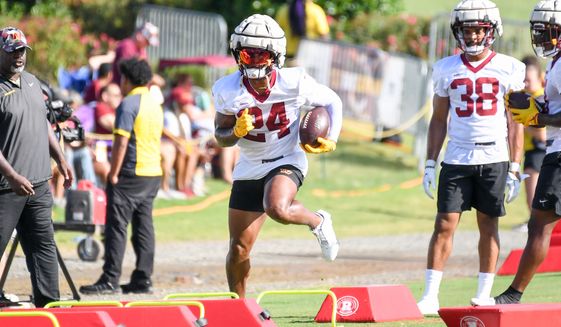 Washington Commanders running back Antonio Gibson (24) running with the ball during training camp at the team&#39;s Inova Sports and Performance Center in Ashburn, VA, August 1, 2022. (Photo by All-Pro Reels)