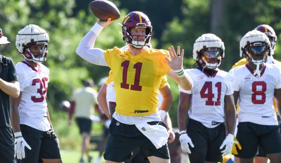 Washington Commanders quarterback Carson Wentz (11) making a throw during training camp at the team&#39;s Inova Sports and Performance Center in Ashburn, VA, August 1, 2022. (Photo by All-Pro Reels)