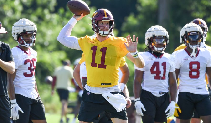 Washington Commanders quarterback Carson Wentz (11) making a throw during training camp at the team&#39;s Inova Sports and Performance Center in Ashburn, VA, August 1, 2022. (Photo by All-Pro Reels)