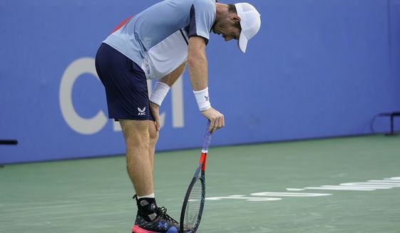 Andy Murray, of Britain, pauses during a first-round match against Mikael Ymer, of Sweden, at the Citi Open tennis tournament in Washington, Monday, Aug. 1, 2022. (AP Photo/Carolyn Kaster)