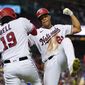 Washington Nationals&#39; Juan Soto, right, celebrates with Josh Bell after his solo home run during the fourth inning of a baseball game against the New York Mets at Nationals Park, Monday, Aug. 1, 2022, in Washington. (AP Photo/Alex Brandon)