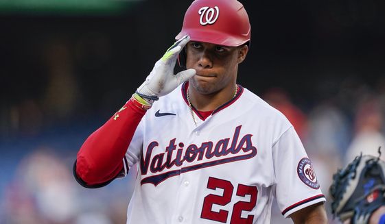 Washington Nationals&#39; Juan Soto acknowledges the New York Mets dugout as he steps in the batter&#39;s box during the first inning of a baseball game at Nationals Park, Monday, Aug. 1, 2022, in Washington. (AP Photo/Alex Brandon)