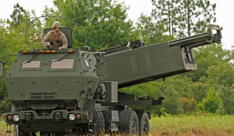 Marine Corps Sgt. Justin Russell, a High Mobility Artillery Rocket System, or HIMARS, section chief with Kilo Battery, 2nd Battalion, 14th Marines looks out over a firing range at Fort Stewart, Ga. during a training exercise, on June 13, 2015. Ukraine has received about a dozen American-built HIMARS multiple rocket launchers and has used them to strike Russian ammunition depots, which are essential for maintaining Moscow&#x27;s edge in firepower. (Corey Dickstein/Savannah Morning News via AP, File)