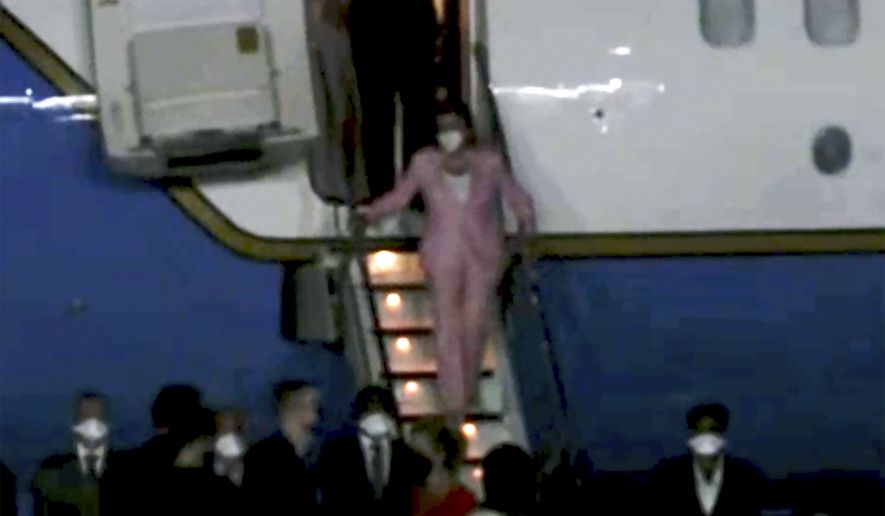 In this image taken from video, U.S. House Speaker Nancy Pelosi exits a plane as she arrives in Taipei, Taiwan, Tuesday, Aug. 2, 2022. Pelosi arrived in Taiwan on Tuesday night despite threats from Beijing of serious consequences, becoming the highest-ranking American official to visit the self-ruled island claimed by China in 25 years. (Taiwan Ministry of Foreign Affairs via AP)