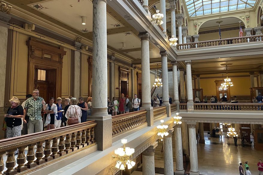 People line up outside the Indiana House chamber in Indianapolis, Tuesday, Aug. 2, 2022, ahead of its morning session to hear testimony on the Senate-approved abortion ban now in consideration by the House. (AP Photo/Arleigh Rodgers)