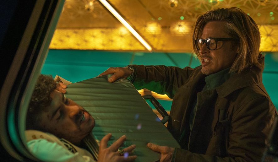 This image released by Sony Pictures shows Bad Bunny, left, and Brad Pitt in a scene from &amp;quot;Bullet Train.&amp;quot; (Scott Garfield/Sony Pictures via AP)
