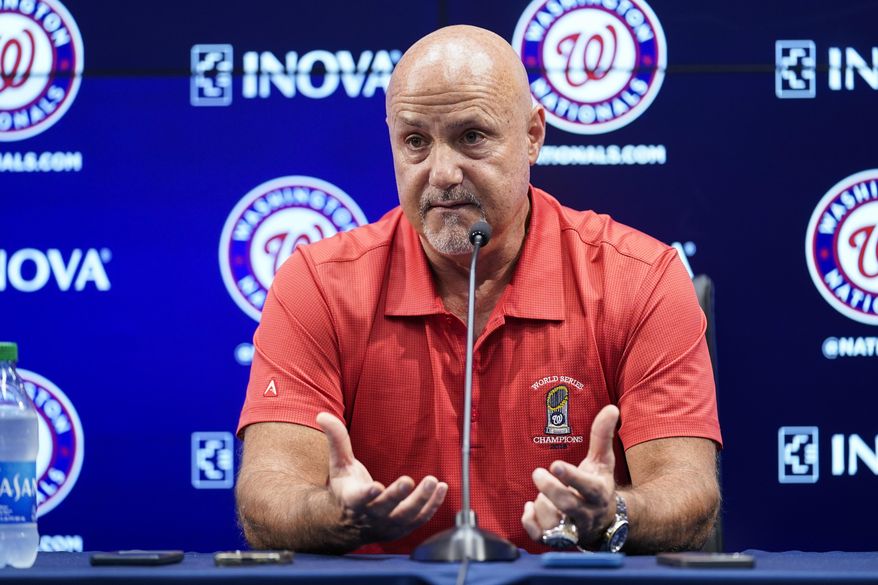 Washington Nationals general manager Mike Rizzo speaks with reporters about the team&#x27;s recent trades before a baseball game against the New York Mets at Nationals Park, Tuesday, Aug. 2, 2022, in Washington. (AP Photo/Alex Brandon)