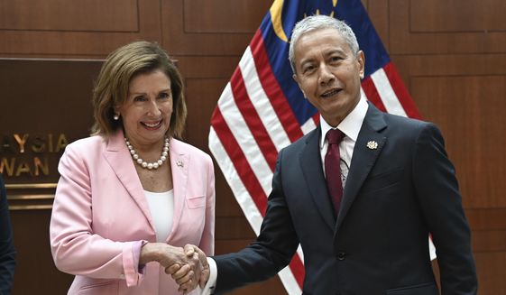 In this handout photo taken and released by Malaysia’s Department of Information, U.S. House Speaker Nancy Pelosi, left, meets with Malaysia Parliament speaker Azhar Azizan Harun in Kuala Lumpur, Tuesday, Aug. 2, 2022. Pelosi arrived in Malaysia on Tuesday for the second leg of an Asian tour clouded by an expected stop in Taiwan, which would escalate tensions with Beijing. (Malaysia’s Department of Information via AP)