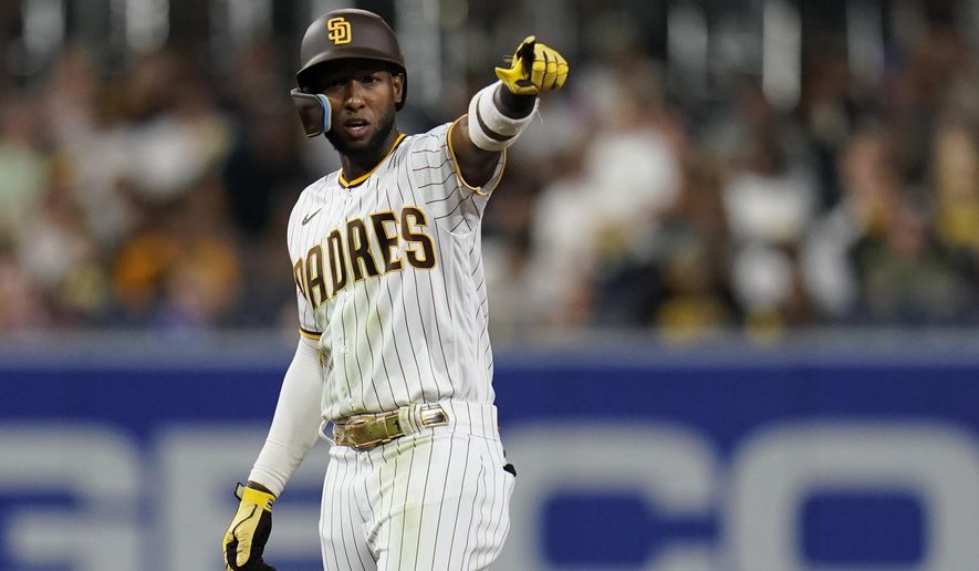 San Diego Padres&#39; Jurickson Profar reacts after hitting a double during the fifth inning of a baseball game against the Colorado Rockies, Monday, Aug. 1, 2022, in San Diego. (AP Photo/Gregory Bull)
