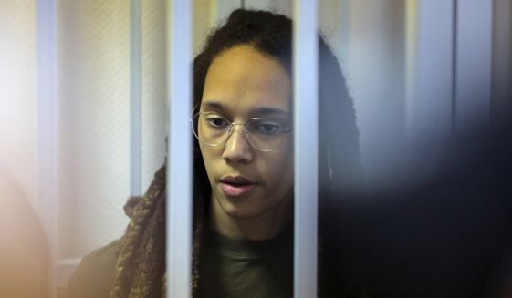 WNBA star and two-time Olympic gold medalist Brittney Griner stands behind bars in a courtroom for a hearing, in Khimki just outside Moscow, Russia, Tuesday, Aug. 2, 2022. Since Griner last appeared in her trial for cannabis possession, the question of her fate expanded from a tiny and cramped courtroom on Moscow&#39;s outskirts to the highest level of Russia-US diplomacy. (Evgenia Novozhenina/Pool Photo via AP)