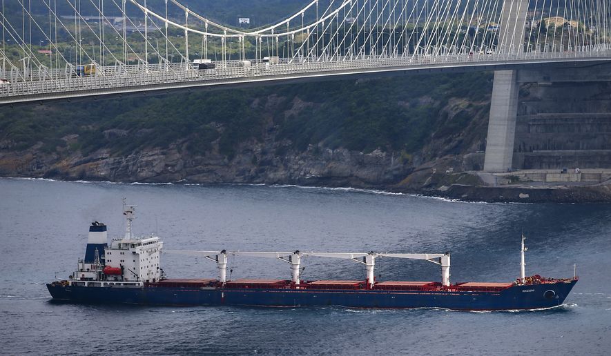 The Sierra Leone-flagged cargo ship Razoni sails under Yavuz Sultan Selim Bridge after being inspected by Russian, Ukrainian, Turkish and U.N. officials at the entrance of the Bosphorus Strait in Istanbul, Turkey, Wednesday, Aug. 3, 2022. Razoni, loaded up with 26,000 tons of corn, is the first cargo ship to leave Ukraine since the Russian invasion, and set sail from Odesa on Monday, August 1, 2022. Its final destination is Lebanon. (AP Photo/Emrah Gurel)