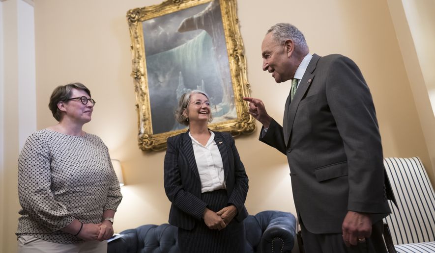 Senate Majority Leader Chuck Schumer, D-N.Y., right, welcomes Paivi Nevala, minister counselor of the Finnish Embassy, left, and Karin Olofsdotter, Sweden&#x27;s ambassador to the U.S., center, just before the Senate vote to ratify NATO membership for the two nations in response to Russia&#x27;s invasion of Ukraine, at the Capitol in Washington, Wednesday, Aug. 3, 2022. (AP Photo/J. Scott Applewhite)