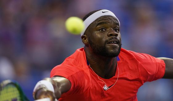 Frances Tiafoe, of the United States, reaches for a forehand shot during a match against Christopher Eubanks, of the United States, at the Citi Open tennis tournament in Washington, Wednesday, Aug. 3, 2022. (AP Photo/Carolyn Kaster)