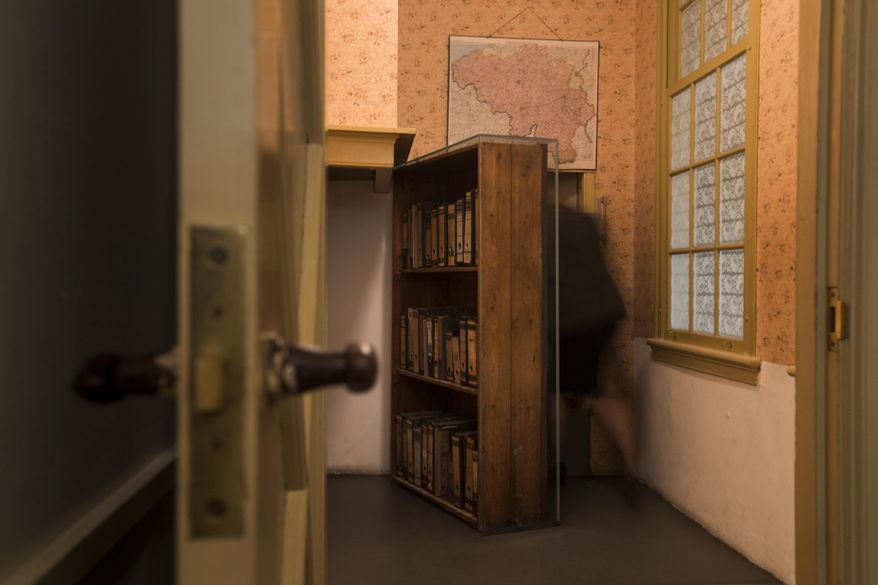 A woman enters the secret annex at the renovated Anne Frank House Museum in Amsterdam, Netherlands, Wednesday, Nov. 21, 2018. The Anne Frank House museum is releasing on Thursday, Aug. 4, 2022, an English-language version of a series of three videos in which an actress playing the young Jewish diarist tells of the last six months of her life, from her arrest to her death in a Nazi concentration camp. (AP Photo/Peter Dejong, File)
