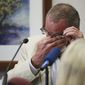Neil Heslin, the father of 6-year-old Sandy Hook shooting victim Jesse Lewis, becomes emotional during his testimony during the trial for Alex Jones, Tuesday, Aug. 2, 2022, at the Travis County Courthouse in Austin. Jones has been found to have defamed the parents of a Sandy Hook student for calling the attack a hoax. (Briana Sanchez/Austin American-Statesman via AP, Pool)