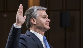 FBI Director Christopher A. Wray is sworn in to testify at a Senate Judiciary Committee oversight hearing, at the Capitol in Washington, Thursday, Aug. 4, 2022. (AP Photo/J. Scott Applewhite)