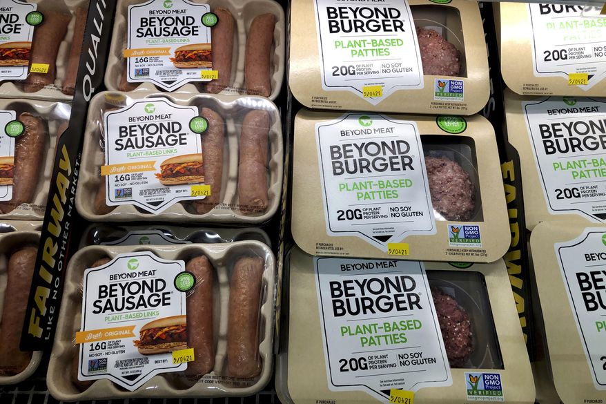 Packages of Beyond Meat&#39;s Beyond Burgers and Beyond Sausage, are shown in this photo, in New York, on April 29, 2021. The plant-based meat maker said Thursday, Aug. 4, 2022, it’s laying off 4% of its workforce after a difficult second quarter that saw cost-conscious customers bypass its higher-priced products. (AP Photo/Richard Drew, File)