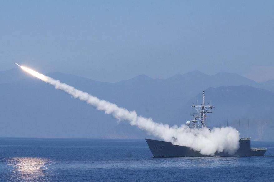 A Cheng Kung class frigate fires an anti-air missile as part of a navy demonstration in Taiwan&#x27;s annual Han Kuang exercises off the island&#x27;s eastern coast near the city of Yilan, Taiwan on July 26, 2022. Taiwan has put its military on alert and staged civil defense drills. (AP Photo/Huizhong Wu, File)