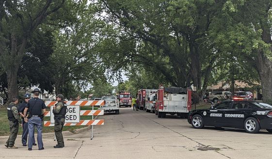 Barricades block off a portion of Elm Street in Laurel, Neb., Thursday, Aug. 4, 2022. The Nebraska State Patrol is investigating a situation with multiple fatalities that occurred in Laurel on Thursday morning. Emergency personnel from the state patrol, Belden and the Cedar County Sheriff&#39;s Department were working in the area. (Riley Tolan-Keig/The Norfolk Daily News via AP)