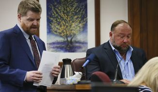 Mark Bankston, lawyer for Neil Heslin and Scarlett Lewis, asks Alex Jones questions about text messages during trial at the Travis County Courthouse in Austin, Wednesday Aug. 3, 2022. Jones testified Wednesday that he now understands it was irresponsible of him to declare the Sandy Hook Elementary School massacre a hoax and that he now believes it was “100% real.&amp;quot; (Briana Sanchez/Austin American-Statesman via AP, Pool)