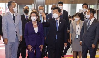 U.S. House Speaker Nancy Pelosi, second from left, is escorted by South Korean National Assembly Speaker Kim Jin Pyo upon her arrival at the National Assembly in Seoul, South Korea, Thursday, Aug. 4, 2022. (Lee Jung-hoon/Yonhap via AP)