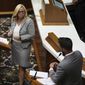 Republican Rep. Wendy McNamara, left, listens to questions from Republican Rep. Matt Hostettler, right, before a vote is held on Senate Bill 1 during a special session Friday, Aug. 5, 2022, at the Indiana Statehouse in Indianapolis. The bill bans abortions at zero weeks except in the cases of rape, incest or to protect the life of the pregnant person. (Jenna Watson/The Indianapolis Star via AP)