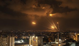 Rockets fired by Palestinian militants toward Israel, in Gaza City, Friday, Aug. 5, 2022. Palestinian officials say Israeli airstrikes on Gaza have killed at least 10 people, including a senior militant, and wounded 55 others. (AP Photo/Fatima Shbair)