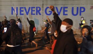Protesters march on Sept. 24, 2020, in Louisville, Ky. Louisville activists who put in long hours protesting the death of Breonna Taylor say they felt relief this week when federal officials charged four officers on Thursday, Aug. 4, 2022. (AP Photo/John Minchillo, File)