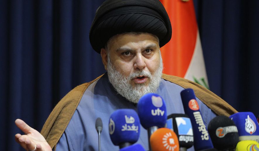 Populist Shiite cleric Muqtada al-Sadr, speaks during a mews conference in Najaf, Iraq, Nov. 18, 2021. Residents of the impoverished Baghdad suburb of Sadr City say they they support al-Sadr an influential Shiite cleric who called on thousands of his followers to storm Iraq&#x27;s parliament. Al-Sadr derives his political weight largely from their seemingly unending support. And yet, they are among Iraq’s most destitute. (AP Photo/Anmar Khalil, File)