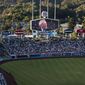 A screen at Dodger Stadium shows late broadcaster Vin Scully during a tribute to him before a baseball game between the Los Angeles Dodgers and the San Diego Padres on Friday, Aug. 5, 2022, in Los Angeles. (AP Photo/Jae C. Hong) **FILE**