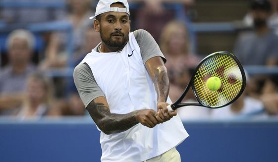 Nick Kyrgios, of Australia, returns a shot against Mikael Ymer, of Sweden, during a match at the Citi Open tennis tournament Saturday, Aug. 6, 2022, in Washington. (AP Photo/Nick Wass)