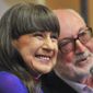 Seekers lead singer Judith Durham with fellow band member and guitarist Athol Guy attends at media conference in Melbourne, Australia on Sept. 10, 2013. Lead singer of The Seekers, Durham, has died aged 79 in Melbourne, Friday, Aug. 5, 2022, after suffering complications from a long-standing lung disease, her management said. (Julian Smith/AAP Image via AP)