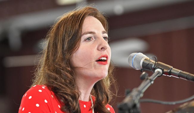 Kentucky State Treasurer Allison Ball addresses the audience gathered during the Fancy Farm Picnic at St. Jerome Catholic Church in Fancy Farm, Ky., Saturday, Aug. 6, 2022. (AP Photo/Timothy D. Easley)