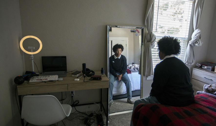 Quinay Gatling, 16, is pictured in a corner of her bedroom at her Chesapeake, Va., home, Friday ,July 29,2022, where she composed a song called &amp;quot;Granby Street.&amp;quot; (Bill Tiernan/The Virginian-Pilot via AP)