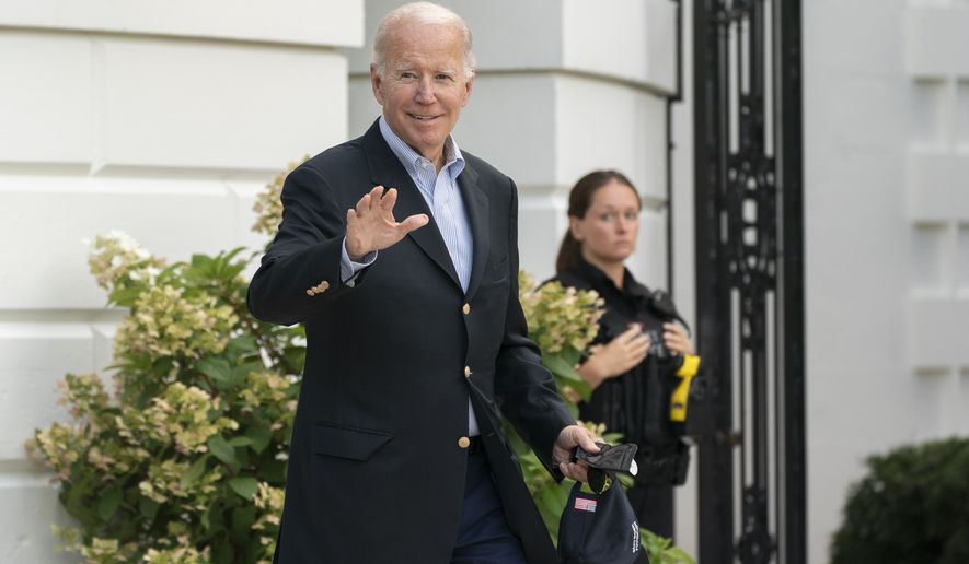 President Joe Biden waves as he walk to board Marine One on the South Lawn of the White House in Washington, on his way to his Rehoboth Beach, Del., home after his most recent COVID-19 isolation, Sunday, Aug. 7, 2022. (AP Photo/Manuel Balce Ceneta)