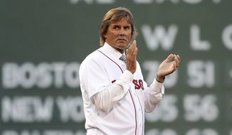 Baseball Hall of Famer and former Boston Red Sox pitcher Dennis Eckersley applauds during pregame ceremonies before a baseball game between the Boston Red Sox and the New York Yankees at Fenway Park in Boston Saturday, Aug. 19, 2017. Hall of Fame pitcher Dennis Eckersley said Monday, Aug. 8, 2022, that he will be leaving the Boston Red Sox broadcasts at the end of the season, his 50th in Major League Baseball.(AP Photo/Winslow Townson, File)