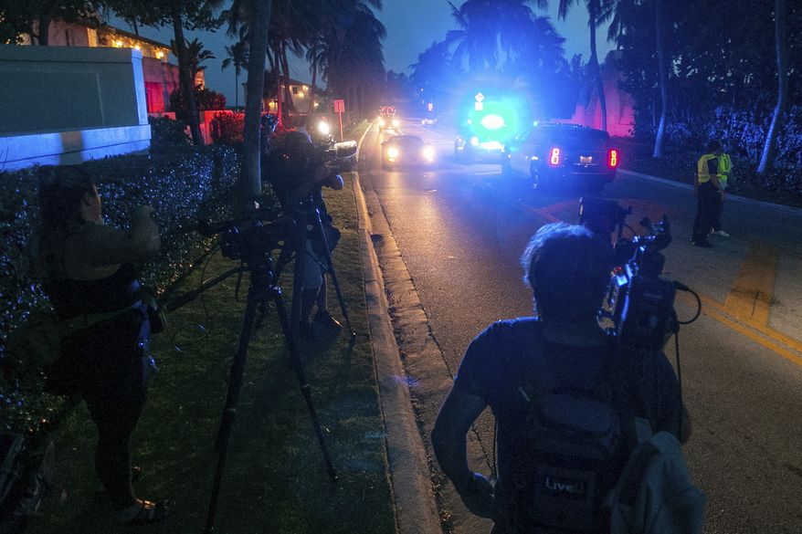 Media stand outside Mar-A-Lago in Palm Beach, Fla., on Monday, August 8, 2022. (Andres Leiva/The Palm Beach Post via AP)