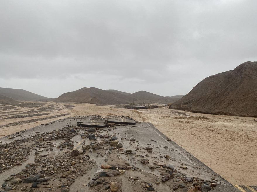 In this photo provided by the National Park Service, Mud Canyon Road is closed due to flash flooding in Death Valley, Calif., Friday, Aug. 5, 2022. Authorities say the main roadway into Death Valley National Park will remain closed into the following week as crews clean up after record-breaking rains damaged the roadway and choked it with mud, rocks and debris. (National Park Service/Death Valley National Park via AP, File)