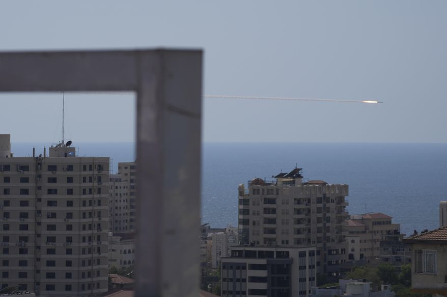 A rocket is launched from the Gaza Strip towards Israel, in Gaza City, Sunday, Aug. 7, 2022. Close to one-third of the Palestinians who died in the latest outbreak of violence between Israel and Gaza militants may have been killed by errant rockets fired by Islamic Jihad fighters, according to an Israeli military assessment that appears consistent with independent reporting by The Associated Press. (AP Photo/Hatem Moussa, File)