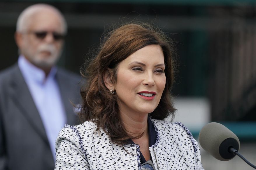 Michigan Gov. Gretchen Whitmer addresses the press before signing the final piece of a $76 billion state budget into law, Wednesday, July 20, 2022 in Detroit. Whitmer largely backed the plan she signed off on Wednesday but nixed money that Republicans had funneled toward anti-abortion causes. (AP Photo/Carlos Osorio)