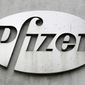 The Pfizer logo is displayed on the exterior of a former Pfizer factory, on May 4, 2014, in the Brooklyn borough of New York. Pfizer is buying sickle cell drugmaker Global Blood Therapeutics in an approximately $5.4 billion deal as it looks to accelerate growth after its revenue soared during the pandemic. Both companies&#39; boards have approved the deal, which still needs regulatory approval and approval from GBT shareholders. (AP Photo/Mark Lennihan, File)