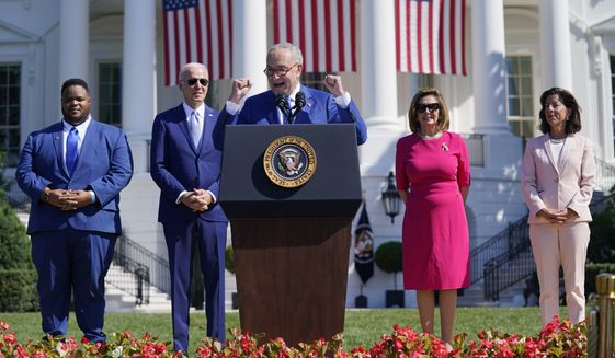 Senate Majority Leader Chuck Schumer of N.Y., speaks before President Joe Biden signs the &quot;CHIPS and Science Act of 2022&quot; during a ceremony on the South Lawn of the White House, Tuesday, Aug. 9, 2022, in Washington. From left, Joshua Aviv, founder and CEO of SparkCharge, Biden, Schumer, House Speaker Nancy Pelosi of Calif., and Secretary of Commerce Gina Raimondo. (AP Photo/Evan Vucci)