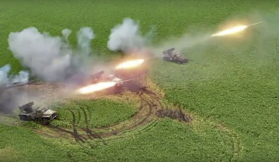 This handout photo taken from video released by Russian Defense Ministry Press Service on Monday, Aug. 8, 2022, shows the Russian military&#39;s Grad multiple rocket launchers firing rockets at Ukrainian troops at an undisclosed location. (Russian Defense Ministry Press Service photo via AP)