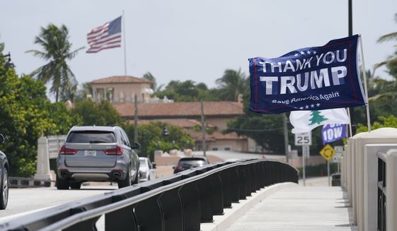 A flag flies in the air near former President Donald Trump&#39;s Mar-a-Lago estate, Tuesday, Aug. 9, 2022, in Palm Beach, Fla. The FBI searched Trump&#39;s Mar-a-Lago estate as part of an investigation into whether he took classified records from the White House to his Florida residence, people familiar with the matter said Monday. (AP Photo/Lynne Sladky) ** FILE **