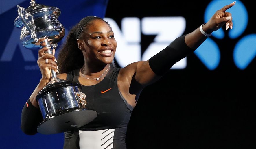 Serena Williams holds her trophy after defeating her sister Venus during the women&#39;s singles final at the Australian Open tennis championships in Melbourne, Australia, Saturday, Jan. 28, 2017. Serena Williams says she is ready to step away from tennis after winning 23 Grand Slam titles, turning her focus to having another child and her business interests. “I’m turning 41 this month, and something’s got to give,” Williams wrote in an essay released Tuesday, Aug. 9, 2022, by Vogue magazine. (AP Photo/Dita Alangkara, File)