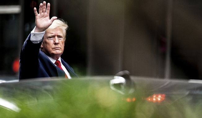 Former President Donald Trump waves as he departs Trump Tower, Wednesday, Aug. 10, 2022, in New York, on his way to the New York attorney general&#x27;s office for a deposition in a civil investigation. (AP Photo/Julia Nikhinson)