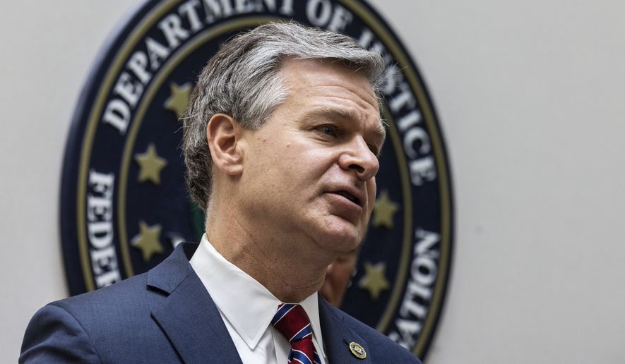 FBI Director Christopher Wray speaks to journalists at the Omaha FBI office on Wednesday, Aug. 10, 2022. Wray addressed threats made to law enforcement after agents raided Mar-a-Lago residence. (Chris Machian/Omaha World-Herald via AP)