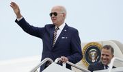 President Joe Biden waves as he boards Air Force One with his son Hunter Biden at Andrews Air Force Base, Md., Wednesday, Aug. 10, 2022. The President is traveling to Kiawah Island, S.C., for vacation. (AP Photo/Manuel Balce Ceneta)